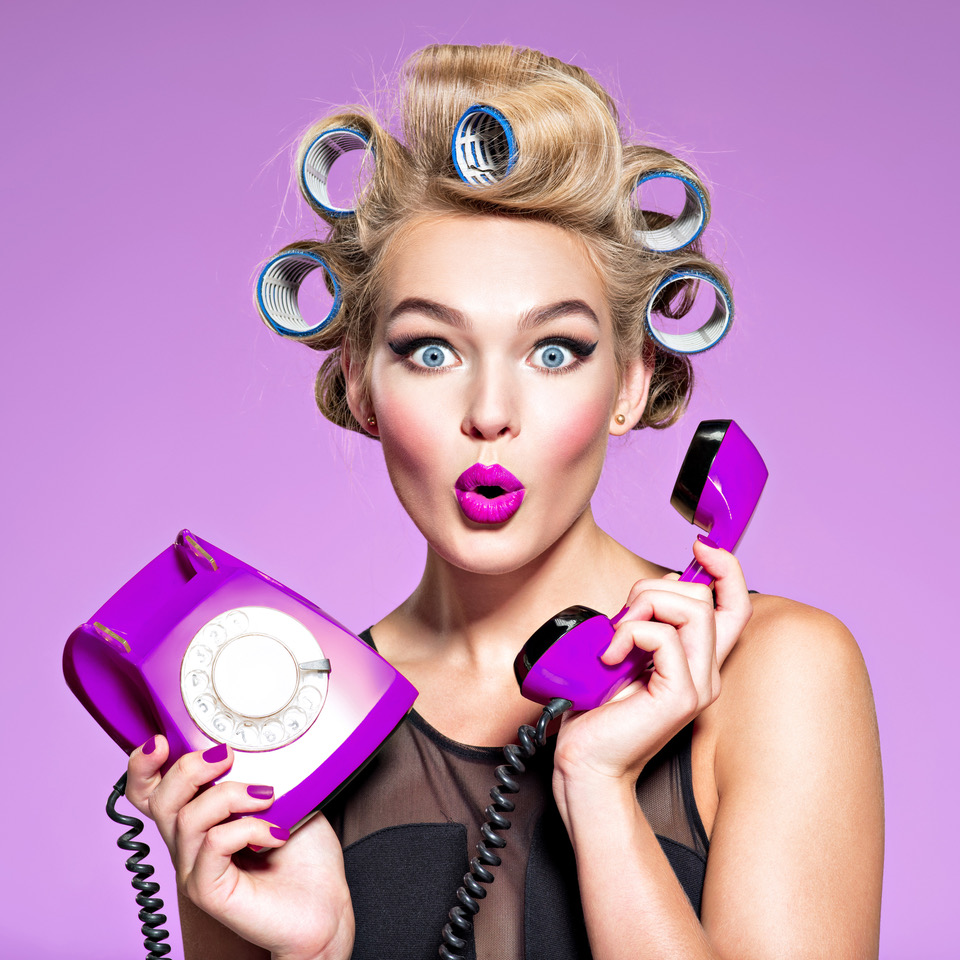 young woman with wonder face holds retro phone | Get Violet daily iodine supplements for breast pain relief today. Contact us for general inquiries and questions. | Contact us